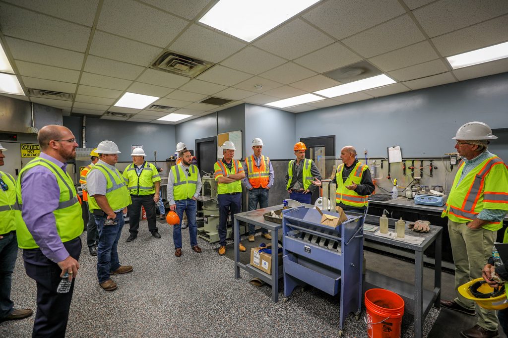 Members from FDOT, Duval Asphalt, ATS, Hubbard, Preferred Materials and ACAF tour the ATS Quality Control Lab in Jacksonville, Florida.